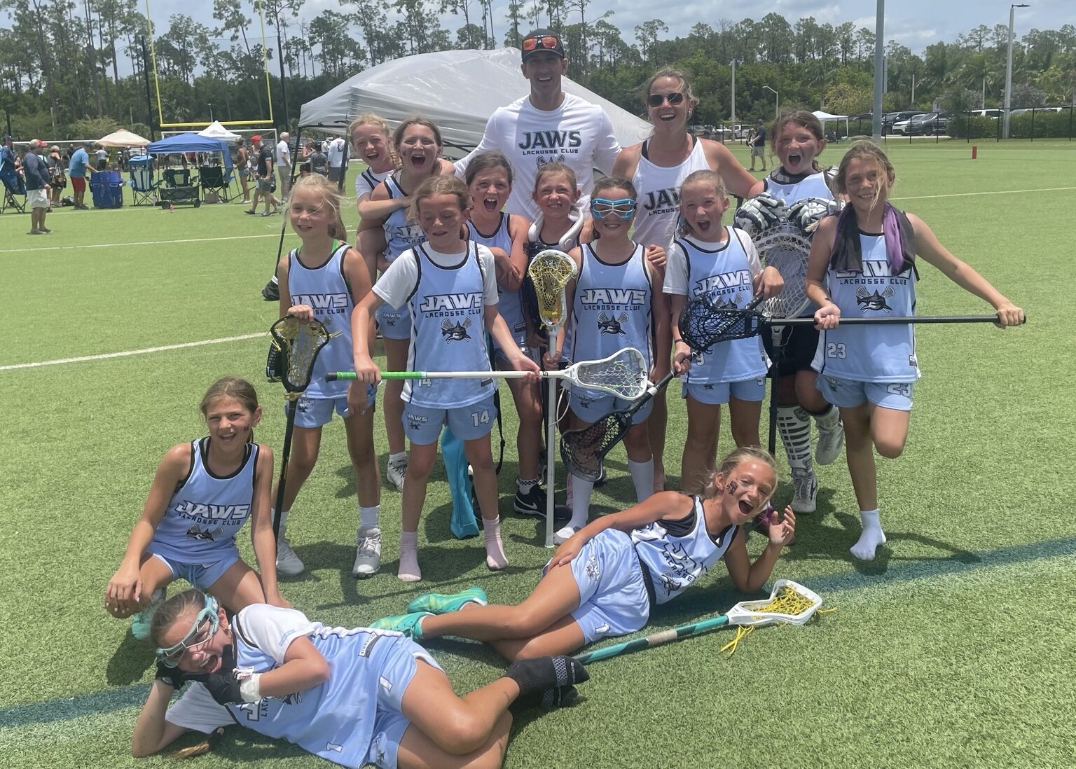 Girls Jaws players celebrating together on the field